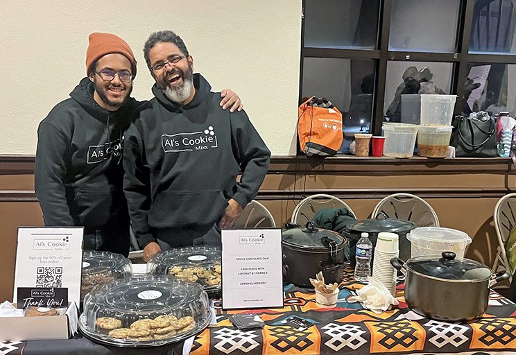 Al’s Cookie Mix owner Alvin Green, right, serves homemade cookies with his son, Asa Green. (Nick Ulanowski/H-F Chronicle)