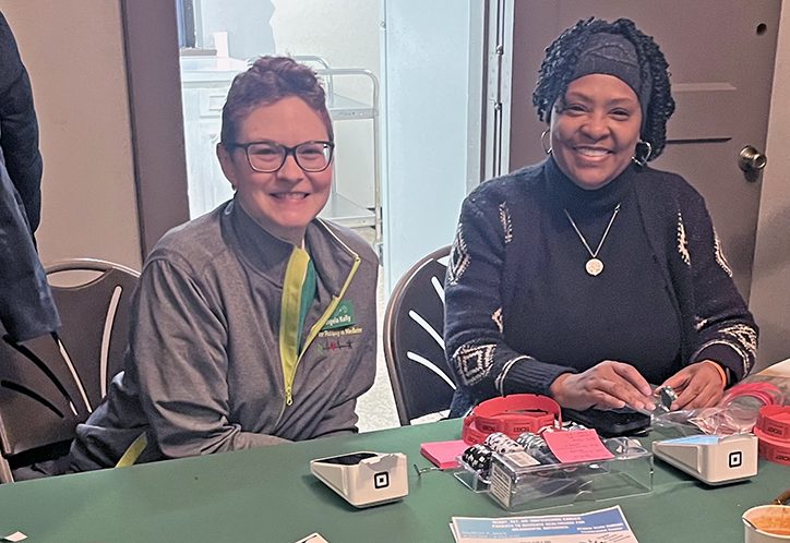 Angie Kelly, left, and Jackie Lanier sell Soup for the Soul tickets to purchase quarts of soup by the front entrance of the Flossmoor Community House. (Nick Ulanowski/H-F Chronicle)