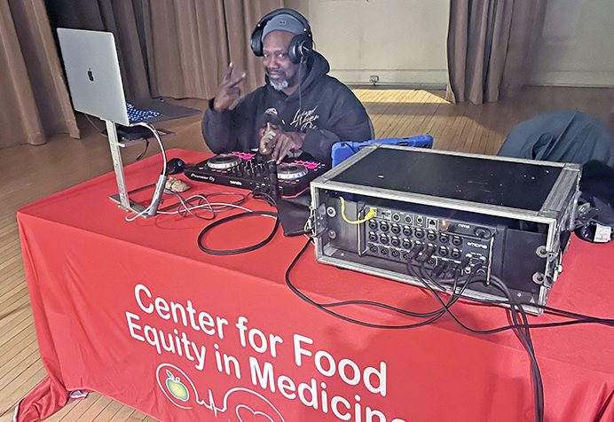 Sound technician and Center For Food Equity in Medicine volunteer Todd “VanBurren" serves as Soup for the Soul's DJ. (Nick Ulanowski/H-F Chronicle)