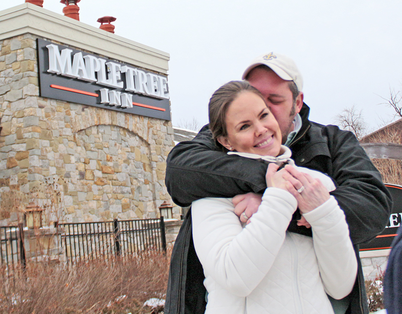 Erich Wennberg gives his wife and business partner, Katie, a kiss after the ribbon cutting ceremony in February 2020 marking the Homewood opening of their restaurant, Maple Tree Inn. (Chronicle file photo)