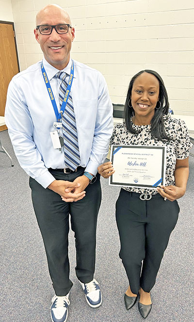 Superintendent Dana Smith stands with fourth quarter Above and Beyond award recipient Aleshia Hill. (Provided photo)