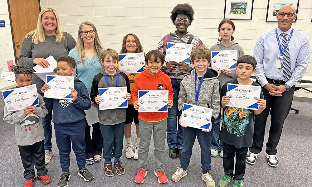 2025 Mathbowl participants recognized by the District 161 Board of Education. Back row, from left, Division A Coach Elaine Wengert, Division B Coach Carrie Gallagher, Max Bizjak, Bree Frye, and Superintendent Dana Smith. Front row, from left, Jonah Roberson, Jaden Vazquez, Edwin Stelk, Joshua Cote, Martin Stelk, and Emilio Gaytan. (Provided photo)