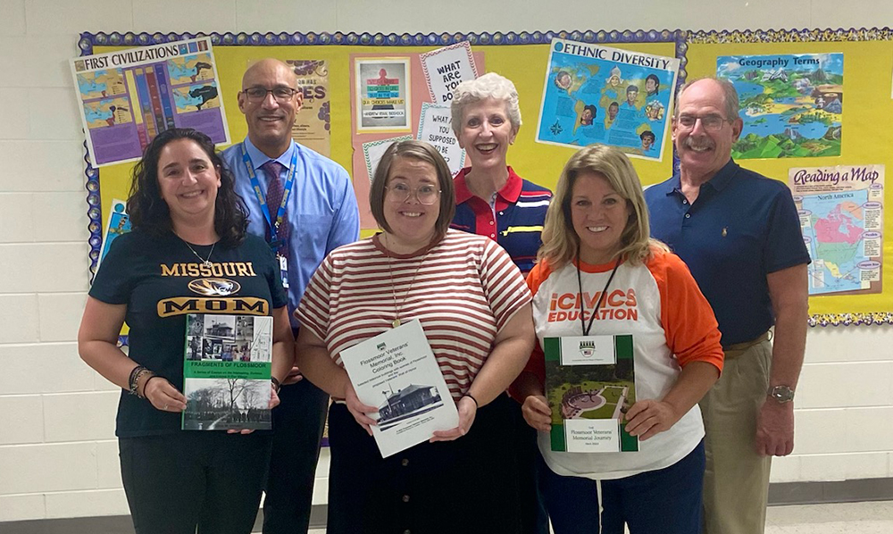 Back row:, from left,, District 161 Superintendent Dana Smith, Flossmoor Veterans Memorial leaders Kris Condon and Paul Braun. Front row, from left, Lisa Nicotra, Social Studies Department chair; Nora Dandurand, Parker Junior High assistant principal; and Linda O’Dwyer, Parker Junior High social studies and humanities teacher. (Provided photo)