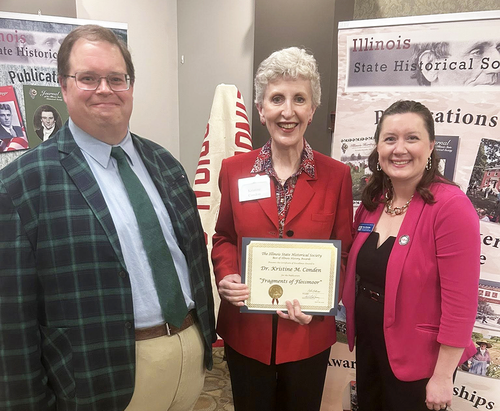 Illinois State Historical Society judges William Shannon IV, left, and Anne Moseley, right, with Flossmoor Veterans Memorial official Kristine Condon, who received a certificate of excellence award for her book, "Fragments of Flossmoor: A Series of Essays on the Interesting, Curious, and Unique in Our Village." (Provided photo)