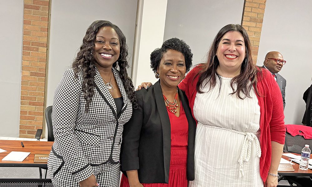 Newly members of the District 233 school board, from left, Tamekia Smith, Camille O'Quin and Ariana Leonard took their oaths of office at the May 6 board meeting. (Marilyn Thomas/H-F Chronicle)