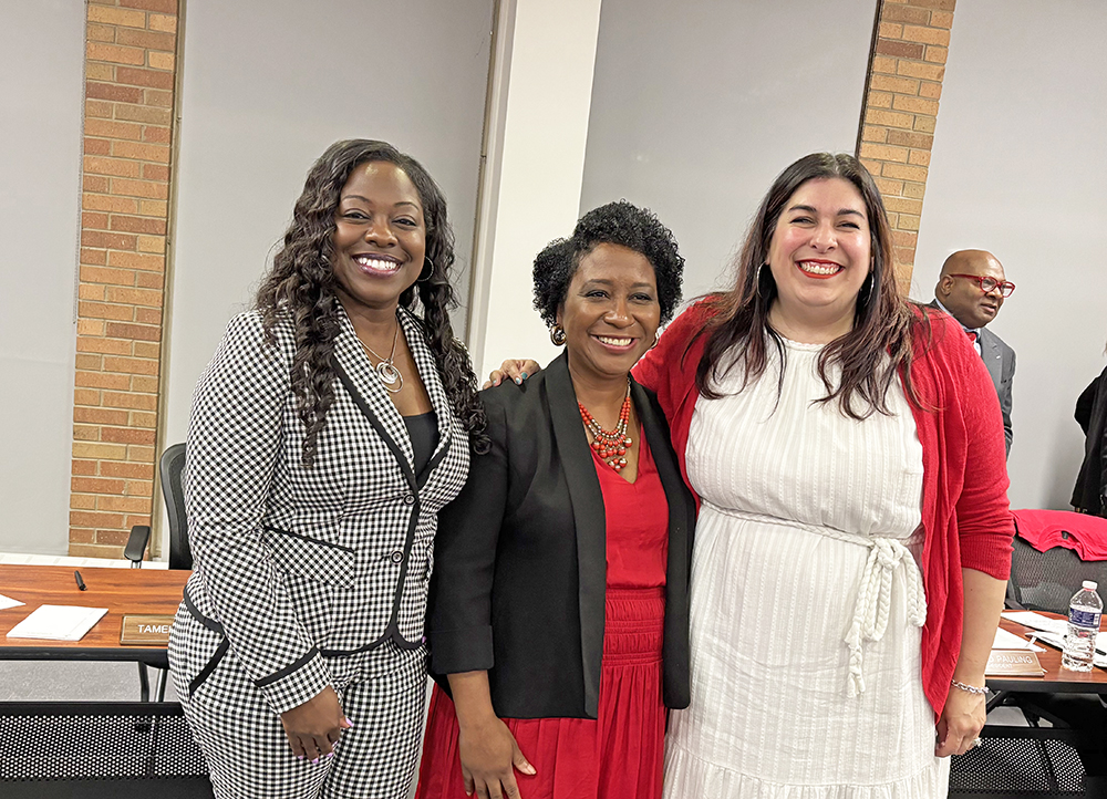 Newly members of the District 233 school board, from left, Tamekia Smith, Camille O'Quin and Ariana Leonard took their oaths of office at the May 6 board meeting. (Marilyn Thomas/H-F Chronicle)