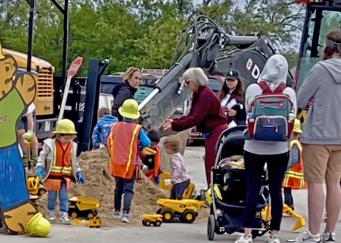 Young ones play in the sand pile and at the dress-up station during the Homewood Public Works Open House. (Summer Kiswani/H-F Chronicle)