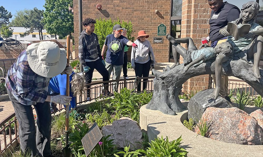 Master Gardener horticulture educator Nancy Kreith, center, points to a task for James Hart School student Johnny Graves, left, and James Hart student Josh Cox, right. (Nick Ulanowski/H-F Chronicle)
