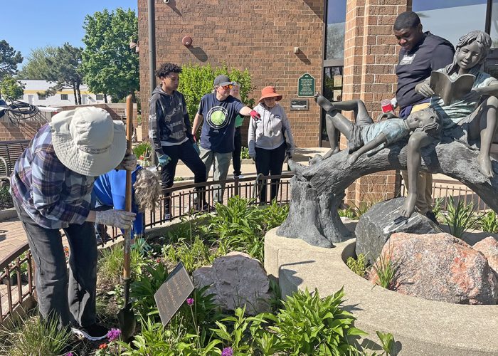 Master Gardener horticulture educator Nancy Kreith, center, points to a task for James Hart School student Johnny Graves, left, and James Hart student Josh Cox, right. (Nick Ulanowski/H-F Chronicle)