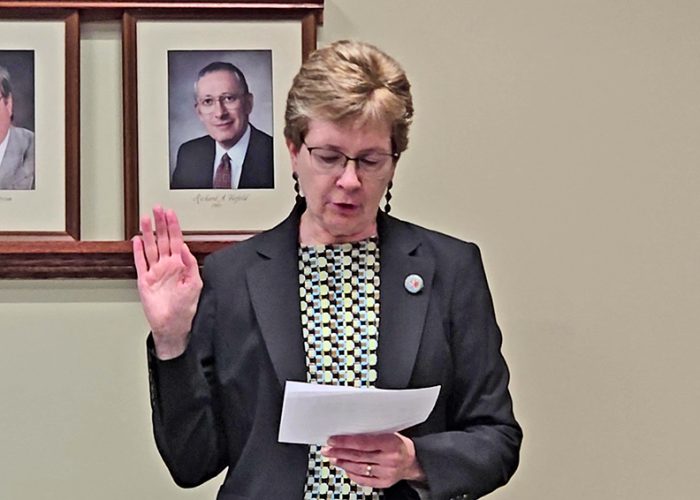 After swearing in many village officials and volunteers over her 10-year career as village clerk, Marilyn Thomas issued a farewell oath to herself at her last board meeting as clerk on May 13. (Eric Crump/H-F Chronicle)
