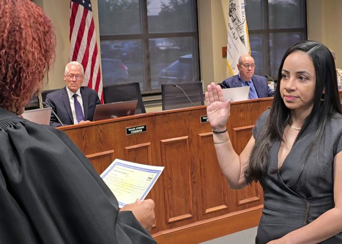 New Homewood Village Clerk Nakina Flores takes the oath of office at the May 13 board meeting. (Eric Crump/H-F Chronicle)