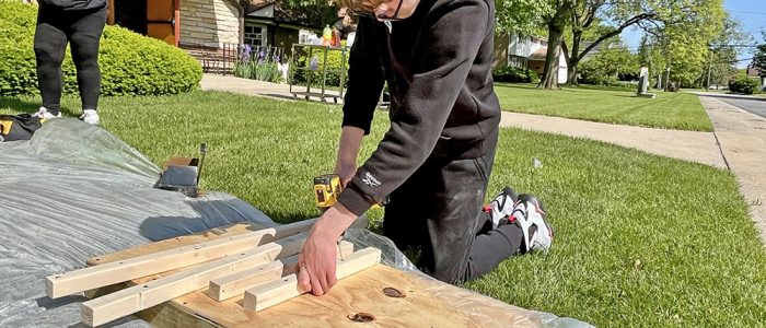 Michael Davis stays focused while drilling during the pantry build at Salem Lutheran Church on Saturday. (Nuha Abdessalam/H-F Chronicle)