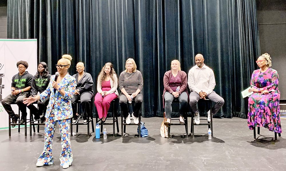 Carmela Wallace of Live Free 999 stands with panelists at Shatter the Silence, joined by Correy Bell, Sarah Whitson, Kofi Shuck, Teri McKean, Kizawanda Olowe, and HF student leaders during the school’s first mental health panel on May 5. (Nuha Abdessalam/H-F Chronicle)