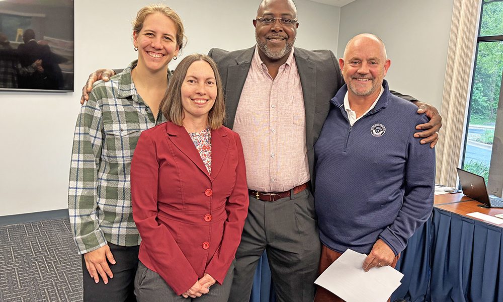 Current members of the Homewood-Flossmoor Park District Board of Commissioners Angie Codere, left, and Brent Bachus, right, welcomed new members Erika Schafer and Byron Walker to the board during the May 20 meeting. (Marilyn Thomas/H-F Chronicle)