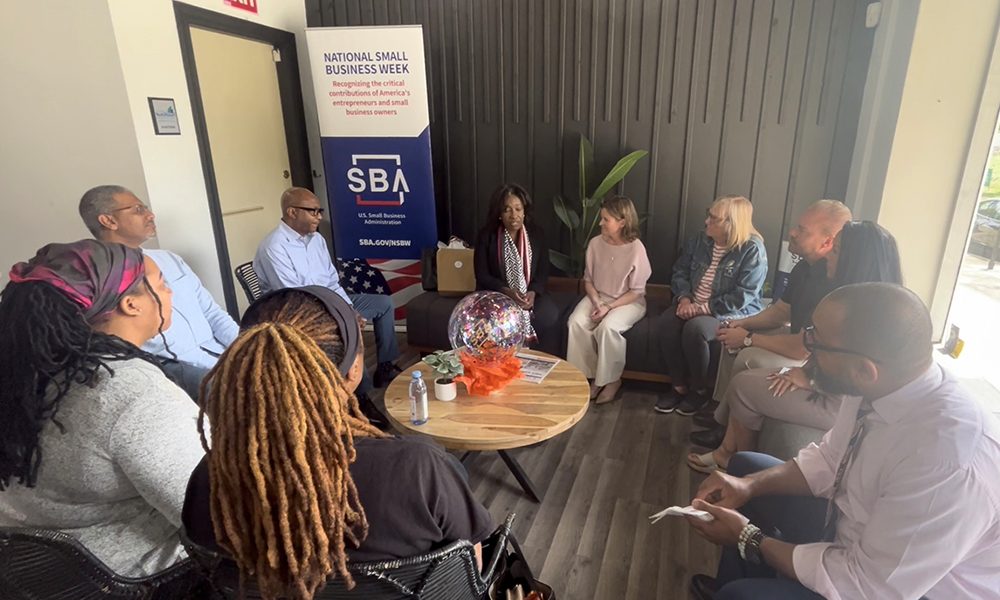 Illinois District Director of the U.S. Small Business Administration (SBA) Willette LeGrant, left, speaks to Flossmoor Mayor Michelle Nelson, right, and Flossmoor small business owners about the services provided by the SBA during a roundtable discussion at D's Cookies in downtown Flossmoor on Wednesday, May 7. (Nick Ulanowski/H-F Chronicle)