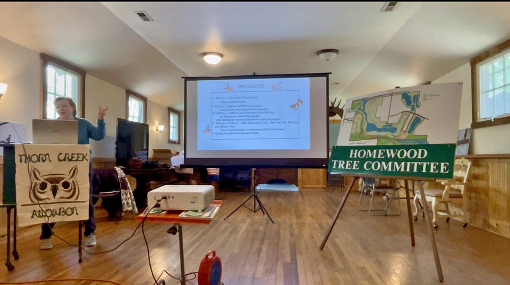 Carolyn Bury presents bird safety tips to World Migratory Bird Day attendees at Izaak Walton. (Summer Kiswani/ H-F Chronicle)
