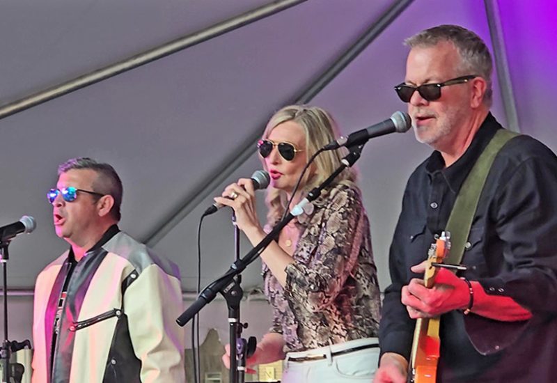 From left, Ted Venegas, Krista Venegas and Matt Epperson of Not My Dad perform at the Homewood Art & Garden Fair on June 6. (Eric Crump/H-F Chronicle)