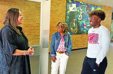 Incoming District 233 Superintendent Jennifer Norrell, left, greets Valerie Leak and her son Quentin Leak. (Marilyn Thomas/H-F Chronicle)