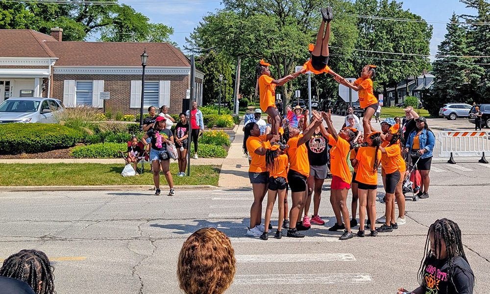 Performers from Meanstreats Elite Cheerleading and Tumbling show off their skills during the Juneteenth Parade in Flossmoor on June 19. (Chris Weber/H-F Chronicle)