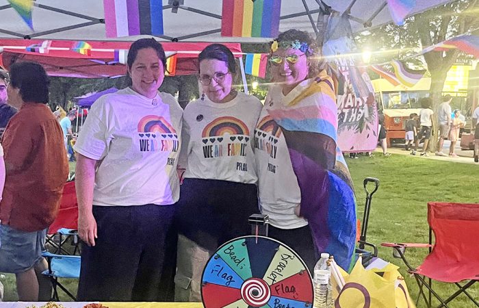 Rachel Nati Hardy, left, Tracey Hill, center, and Rebecca Fassbender at the PFLAG Homewood-Flossmoor booth during H-F Pride Fest on June 20. (Nick Ulanowski/H-F Chronicle)