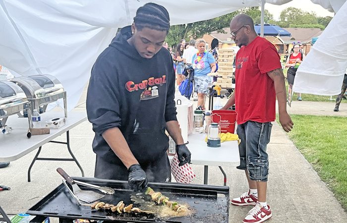 Crab Bagz head chef Marquise Merrell cooks shish kabobs at H-F Pride Fest. (Nick Ulanowski/H-F Chronicle)