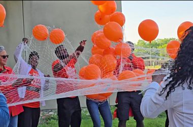 Congresswoman Robin Kelly, left, helps release biodegradable balloons at Prairie State College on May 31 to honor the lives of those lost to gun violence. (Eric Crump/H-F Chronicle)