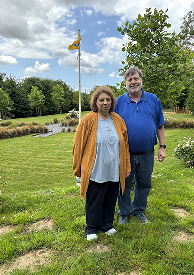 Nancy and Greg Voll in the gardens at the C-47 memorial park in Normandy on June 2. “The garden is hard to appreciate from the ground level,” Greg said. “There are tall grasses and white flowering plants in the plane area.“ (Provided photo courtesy of Greg and Nancy Voll)