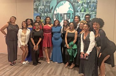Destiny Watson, middle in blue dress,, CEO and founder of You Matter 2, celebrates with organization alumni impacted by the nonprofit’s programs. (Faith Lee/H-F Chronicle)