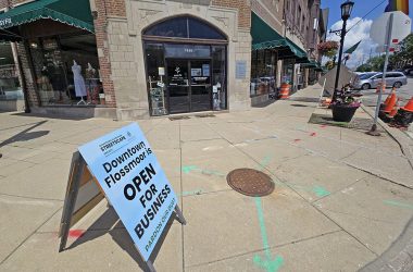A sign at the corner of Flossmoor and Sterling roads reminds visitors that downtown shops will remain open during the streetscape construction work this summer. The village built requirements in the contract to ensure business disruption would be kept to a minimum. (Eric Crump/H-F Chronicle)