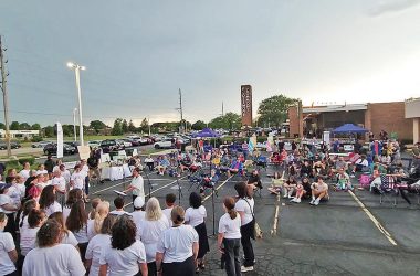 Bel Canto Community Choir perfoorms at Chamber Night on Thursday, July 24, as storm clouds approach from the southwest. At the conclusion of the group's set, Chicago Southland Chamber of Commerce Executive Director Jennel Hooper announced the early end to the event because of lightning in the area. (Eric Crump/H-F Chronicle)