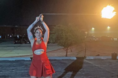 Kara Cordell, also known as Lyka Bo$$, spins fire at the Feast of the Goat Queen. (Nick Ulanowski / H-F Chronicle)