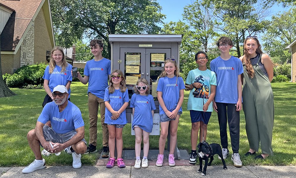 Korey Ziemkowski,, right, with the full team of youth volunteers after the pantry dedication, celebrating their hard work. (Nuha Abdessalam/H-F Chronicle)