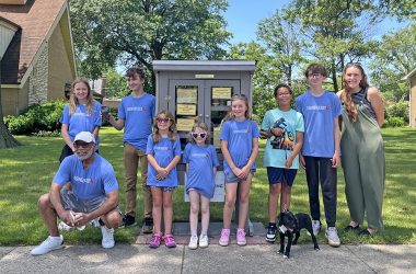 Korey Ziemkowski,, right, with the full team of youth volunteers after the pantry dedication, celebrating their hard work. (Nuha Abdessalam/H-F Chronicle)