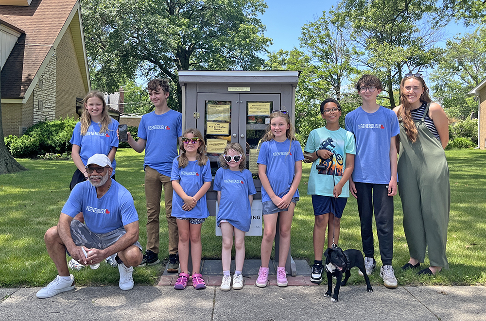 Korey Ziemkowski,, right, with the full team of youth volunteers after the pantry dedication, celebrating their hard work. (Nuha Abdessalam/H-F Chronicle)