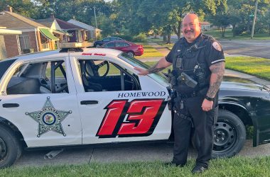 Homewood Police Officer Ken Norbut with the 2010 Crown Victoria that he will drive in the Torch Run Five-O Race to help raise money for Special Olympics Illinois. (Provided photo)