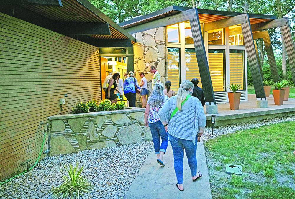 Guests visit a home on the 2023 Modernism Road Rally Tour of Homes in Flossmoor and Olympia Fields. Local architecture hasn't always gotten much attention, but that's changing. A new organization is dedicated to increasing awareness of mid-century modern architectural gems in Flossmoor and Olympia Fields. (Provided photo by Marcellus Marsh/Bionic Content)