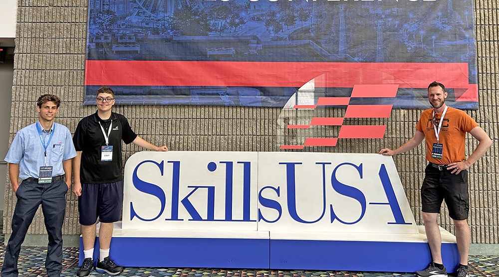 Homewood-Flossmoor High School's Mason Kleinfelder, left, placed 11th in the nation in automotive skills, and Charley Dieringer, center, won second place in programming a milling apparatus, at the national SkillsUSA competition in Atlanta in June. With them is H-F teacher Bill Merchantz, right. (Provided photo)