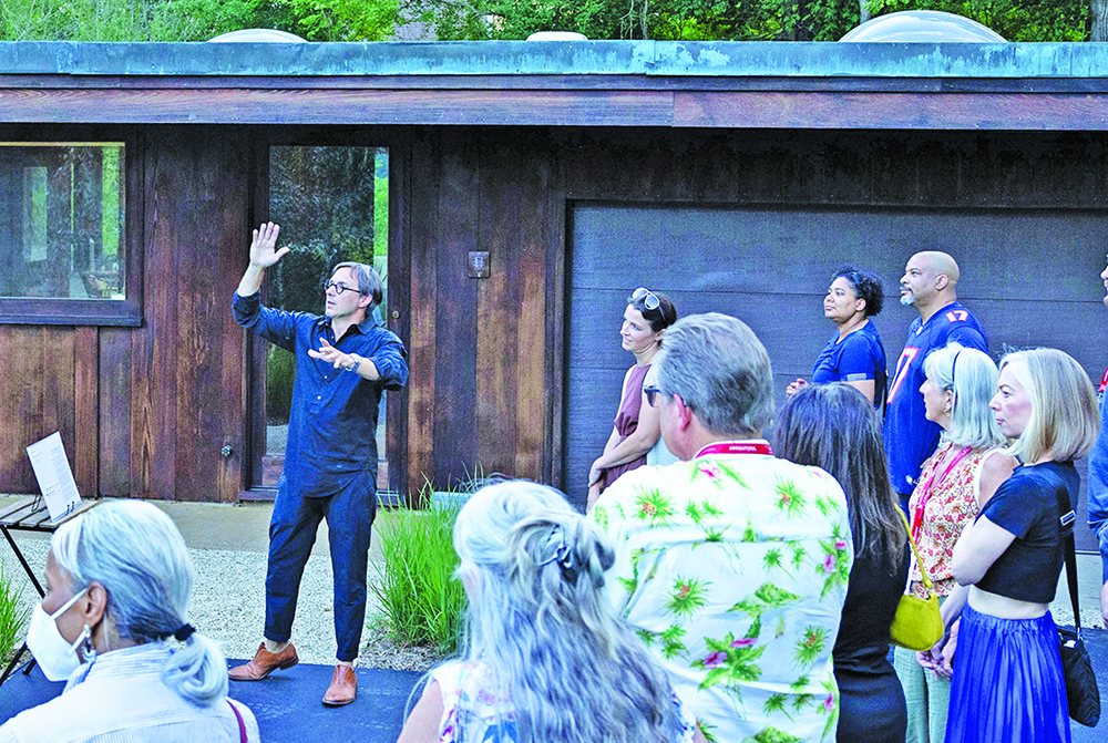 Edward Peck, center with arm raised, speaks to guests at the 2023 Modernism Road Rally. (Provided photo by Marcellus Marsh/Bionic Content)