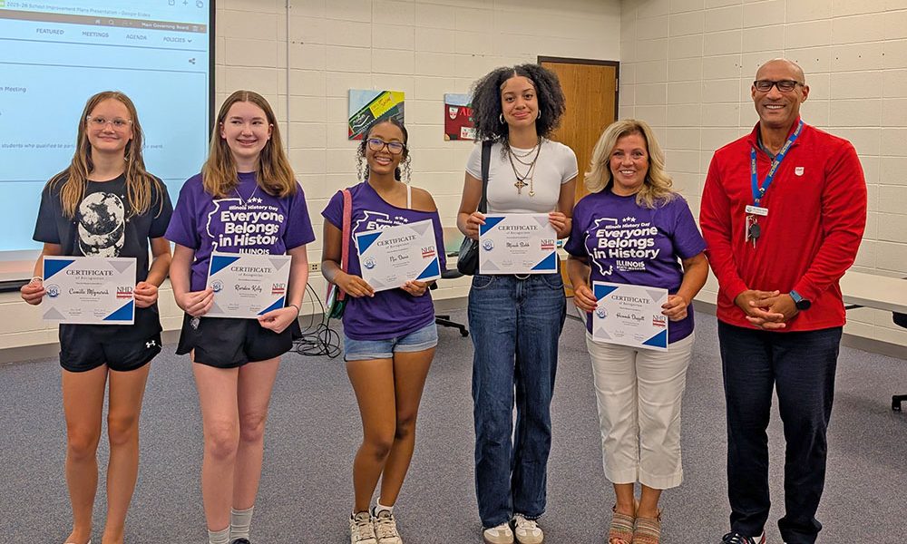 National History Day participants from Parker Junior High. From left: Camille Mlynarcik, Riordan Kelly, Nia Davis, Minah Bobb, Social Studies and Humanities Teacher Linda O'Dwyer and Superintendent Dana Smith. Not pictured: Hannah Daggett. (Chris Weber/H-F Chronicle)