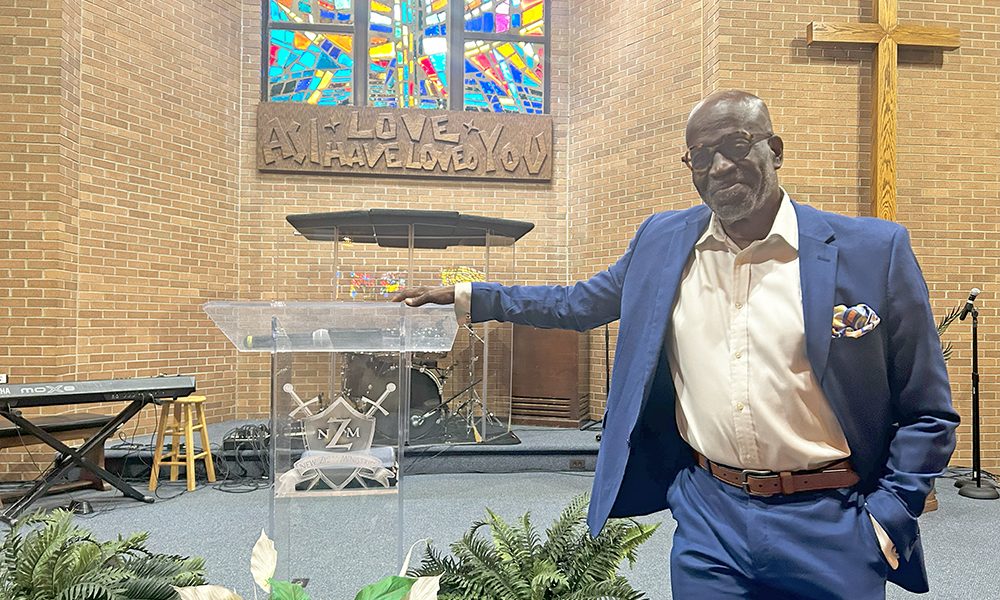Pastor Jimmy Allen Thomas pictured in the new sanctuary where New Zion Ministries' congregation now worships each Sunday. (Faith Lee/H-F Chronicle)