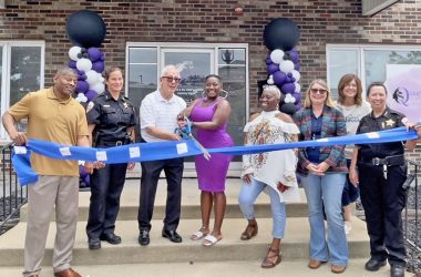 Mayor Rich Hofeld cuts ribbon with Latoya Newman, owner of Queen's Lavish Scents for grand opening on July 11. (Summer Kiswani/ H-F Chronicle)