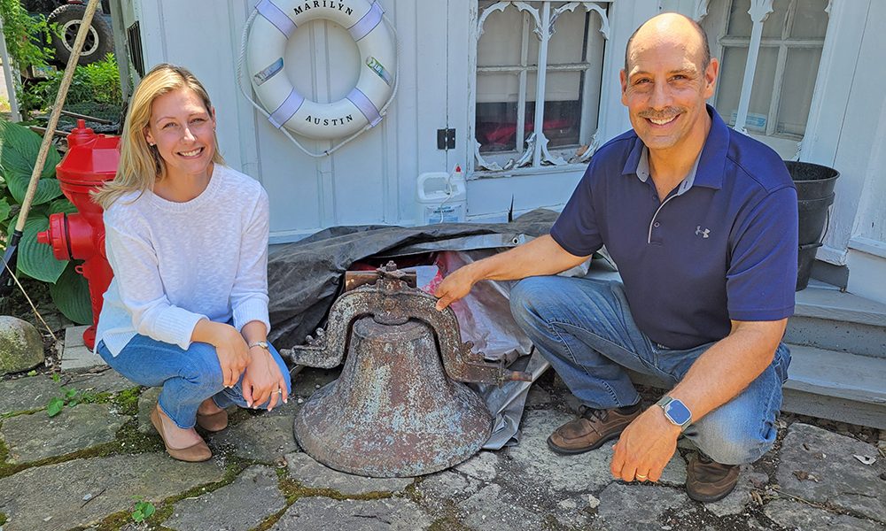 Gina Inwood and John Inwood present the original Homewood School bell to the Homewood Historical Society. (Provided photo)