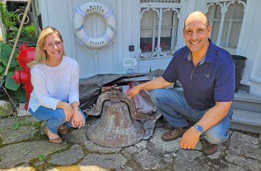 Gina Inwood and John Inwood present the original Homewood School bell to the Homewood Historical Society. (Provided photo)