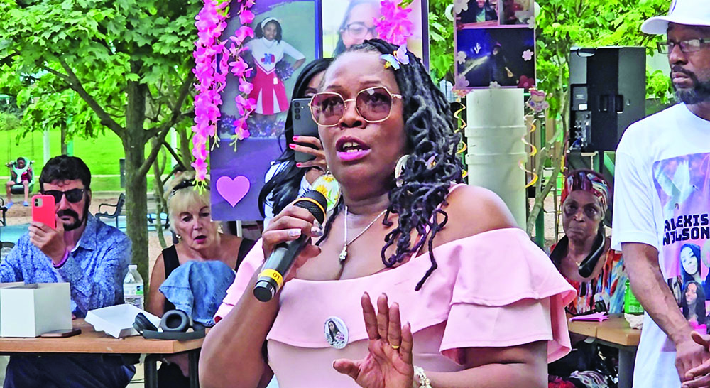 Cara Wilson speaks at the annual butterfly release event in honor of her late daughter, Alexis Wilson, who was slain by Dolton police in 2021. She announced that a book is in the works that explores her family's struggles with Alexis' death. (Eric Crump/H-F Chronicle)
