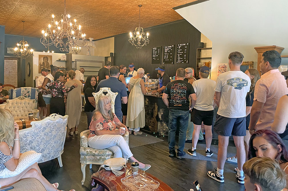 Residents and supporters gather at Beyond Borders Cafe for its grand opening Aug. 9 in Flossmoor. (Jamilah Lewis/H-F Chronicle)