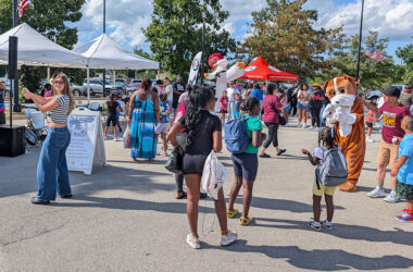 Community members enjoy the festivities at Homewood's 2025 back-to-school party. (Chris Weber/H-F Chronicle)