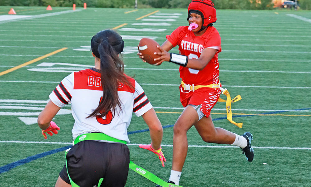 QB Jorie Peters (9) scrambles to the right and breaks the plane for a touchdown. (Benjamin Faoro/H-F Chronicle)
