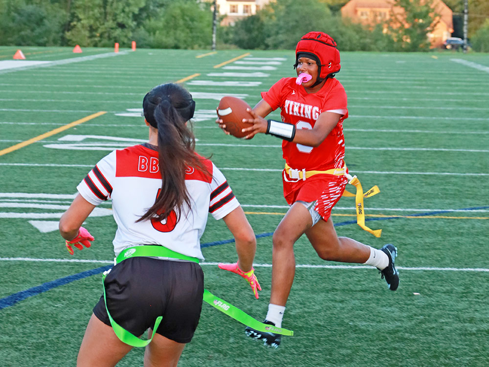 QB Jorie Peters (9) scrambles to the right and breaks the plane for a touchdown. (Benjamin Faoro/H-F Chronicle)