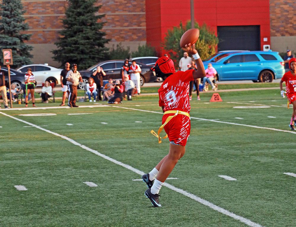 QB Jorie Peters (9) rolls to the right keeping her head down field and throws for a completion. (Benjamin Faoro/H-F Chronicle)