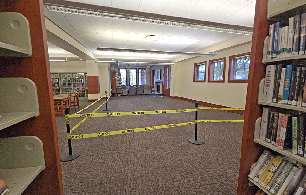 A section on the west side of the Flossmoor Public Library is cordoned off while the village works to solve a small settling of the foundation. (Eric Crump/H-F Chronicle)